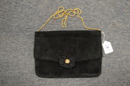 A ladies black velvet evening bag.