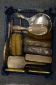 Various silver backed dressing table items.
