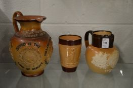 Doulton salt glazed items to include a 1902 Coronation jug, a hunting beaker and a Commemorative jug