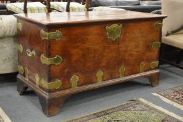A good large teak and brass bound coffer.