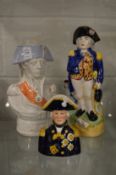 A Staffordshire pottery jug modelled as Nelson together with a similar figural jug and a smaller