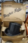 A boxed top hat internal size 8 x 6.5 inches.
