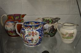 Four Staffordshire jugs decorated in the Chinese style.