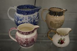 Blue and white jug and three others.