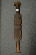 African carved wood paddle or club.