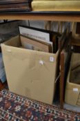 A quantity of paintings and prints.