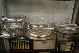 A collection of plated entree dishes and covers.