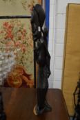 An unusual African carved hardwood figure group.