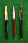 Three Parker pens.