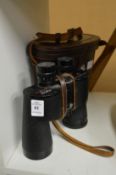 A cased pair of binoculars.