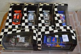 Six boxed Porsche racing cars.