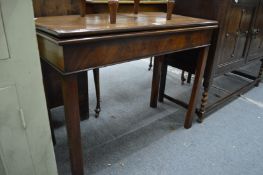 A George III mahogany rectangular fold-over tea table.