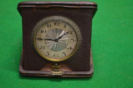 A cased travelling pocket watch.