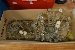 Various cut glass and brass bag chandeliers.