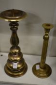 Two brass candlesticks.