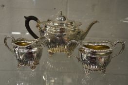 A hallmarked silver teapot with later sterling silver matching sugar bowl and milk jug.