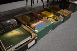 Four boxes of assorted books.