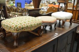 A pair of small mahogany stools and a similar stool.