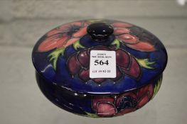 A Moorcroft circular powder bowl and cover with original box.