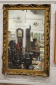 A decorative gilt framed mirror.
