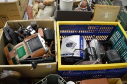 A quantity of cameras and camera equipment.