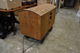 A good handmade model of a shepherd's hut on a wheeled base.
