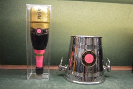 A Piper-Heidsieck Victor Rolf limited edition bottle of champagne and matching ice bucket.