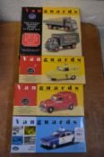 A group of four Vanguards models of police car and other vehicles, all boxed.
