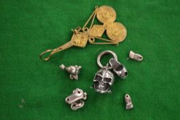 A skull pendant and other items.