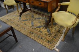 A Persian design gold ground carpet with stylised decoration 200cm x 126cm.