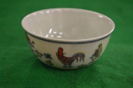 A small Chinese Doucai chicken cup.