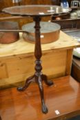 A mahogany tripod table.