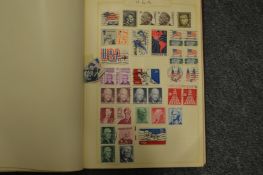 An album containing GB and world stamps.