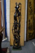 An unusual large carved hardwood figure group.