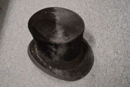 A top hat, interior measurement 7.5 x 6 inches.
