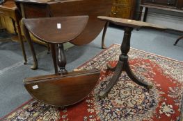 A George III mahogany two tier drop flap dumb waiter on tripod base (af).