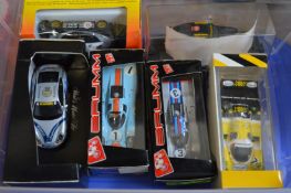 Six boxed Porsche racing cars.