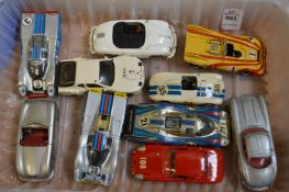 A collection of Porsche and other cars.