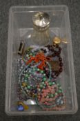 A silver topped sugar castor, silver match case holder and bijouterie.