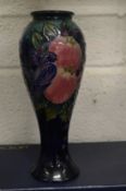 A modern Moorcroft baluster shaped vase with original box.