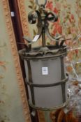A brass and frosted glass hall lantern.