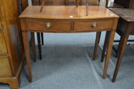 A 19th century mahogany bow fronted two drawer side table.