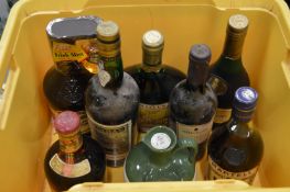 An old bottle of Martell cognac and other items.