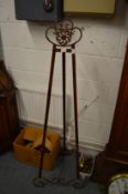 A decorative wrought iron easel.