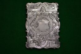 An engraved silver calling card case.