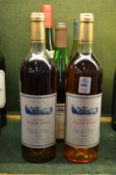 Five bottles of various wine.