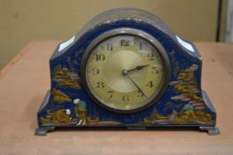 A chinoiserie decorated mantel clock.