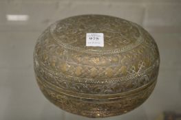 An Eastern white metal engraved box and cover.