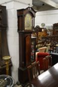 A 19th century mahogany long case clock with eight-day movement, the arched brass dial signed Thomas