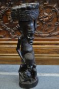 A large African carved hardwood figure group.
